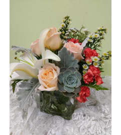 pearly peach. An arrangement by Avenue Flowers and Gifts.
