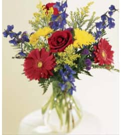 Red Summer. An arrangement by Avenue Flowers and Gifts.