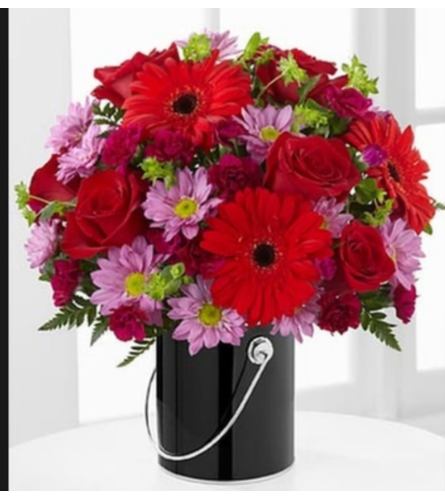 Intrigue. An arrangement by Avenue Flowers and Gifts.