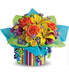 RAINBOW PRESENTS. An arrangement by Avenue Flowers and Gifts.
