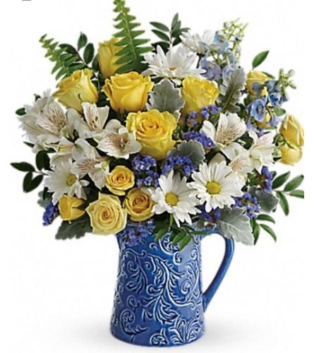 Sky. An arrangement by Avenue Flowers and Gifts.