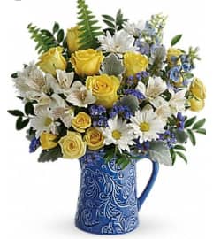 Sky. An arrangement by Avenue Flowers and Gifts.