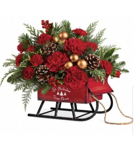 Saint Nicholas Tree Farm Sleigh. An arrangement by Avenue Flowers and Gifts.