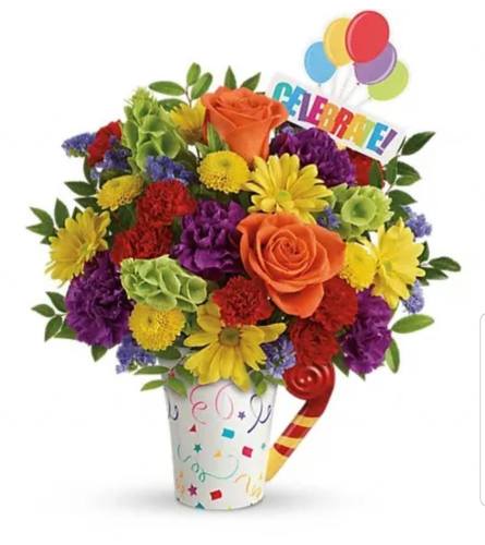 Cheers to Your Celebration Surprise. An arrangement by Avenue Flowers and Gifts.