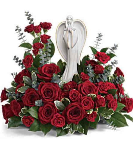 Angel in Red Rose Garden. An arrangement by Avenue Flowers and Gifts.