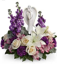 Angel in Purple Garden. An arrangement by Avenue Flowers and Gifts.