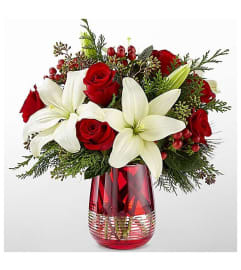 A Festive Holiday. An arrangement by Avenue Flowers and Gifts.
