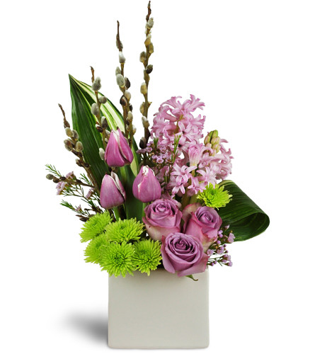 Mom’s Garden™. An arrangement by Avenue Flowers and Gifts. A beautiful assortment of vibrant pink hyacinth, lavender roses, tulips, and more..