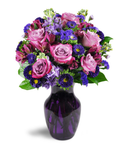 Lovely Lavender™ - Deluxe. An arrangement by Avenue Flowers and Gifts. Sweet lavender roses are cheerfully displayed with alstroemeria, asters,...