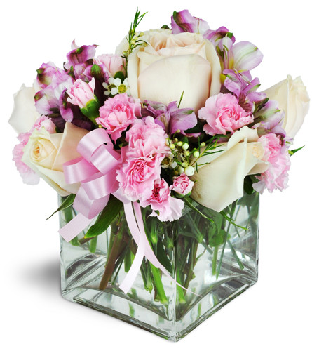 Pink Pastels™. An arrangement by Avenue Flowers and Gifts. Pale pink roses and pink mini carnations are softly arranged with alstroemeria,...