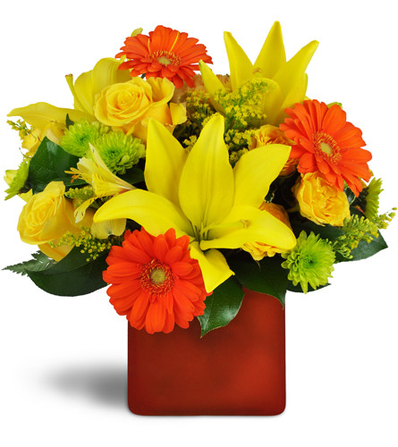 Summer Splash™. An arrangement by Avenue Flowers and Gifts. Orange mini Gebera daisies pop among yellow roses, lilies, and more..