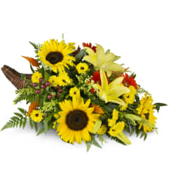 Giving Thanks Cornucopia™. An arrangement by Avenue Flowers and Gifts.