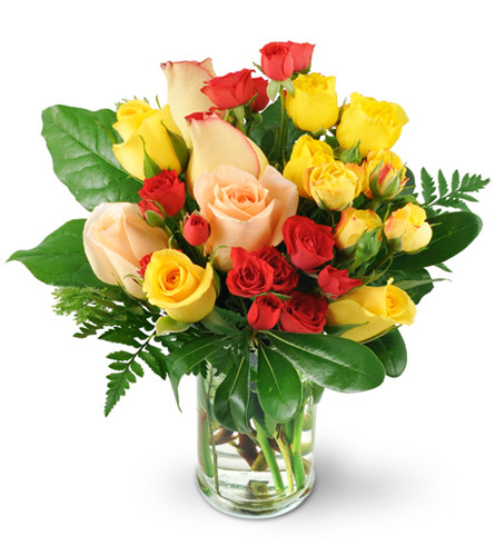 Rose Delight. An arrangement by Avenue Flowers and Gifts. Red, pink, and yellow roses mingle with yellow and red spray roses in a classic vase..