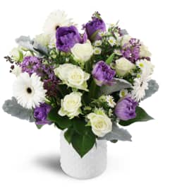 Oasis in Bloom™. An arrangement by Avenue Flowers and Gifts.