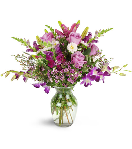 Purple Paradise Orchid Bouquet™. An arrangement by Avenue Flowers and Gifts. Dendrobium orchids, roses, lilies, stock, and waxflower are...
