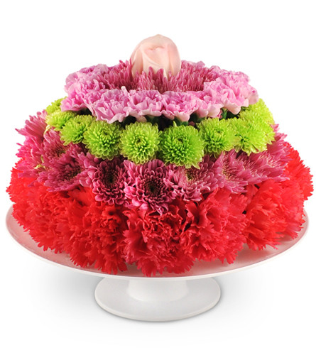 Birthday Treat. An arrangement by Avenue Flowers and Gifts. Wow them with a whimsical cake of carnations, chrysanthemums, miniature carnations,...