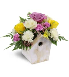 Birdhouse of Blooms. An arrangement by Avenue Flowers and Gifts. Birdhouse of Blooms. An arrangement by Avenue Flowers and Gifts.