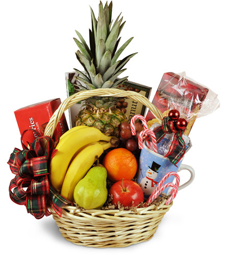 Bountiful Holiday Gift Basket. An arrangement by Avenue Flowers and Gifts. A classic wicker basket overflows with fresh fruit, candy, cookies, and...