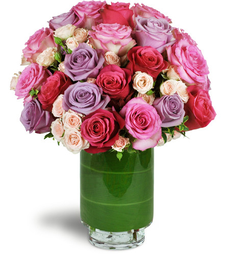 Sweetest Roses™. An arrangement by Avenue Flowers and Gifts. Two dozen premium roses are gorgeously arranged with delicate pink spray roses..