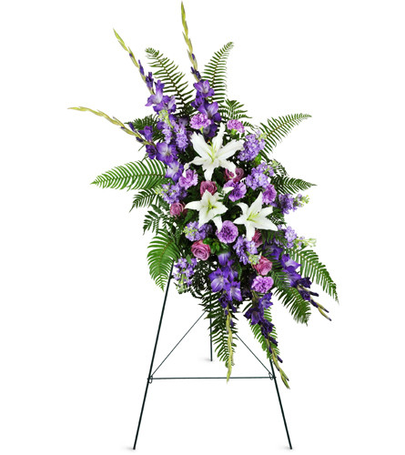 Lavender Memories Spray™. An arrangement by Avenue Flowers and Gifts. Ease feelings of sorrow with white Asiatic lilies, purple gladiolus,...