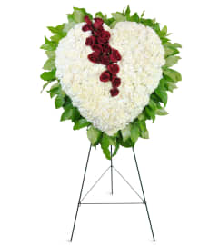 Sympathetic Heart Standing Spray™. An arrangement by Avenue Flowers and Gifts.