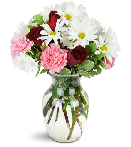 I'm Smitten™. An arrangement by Avenue Flowers and Gifts. Red roses, pink carnations, and charming white daisies are artfully arranged in a...