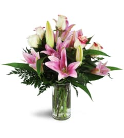 Alluring Roses and Lilies™. An arrangement by Avenue Flowers and Gifts. Alluring Roses and Lilies™. An arrangement by Avenue Flowers and Gifts.