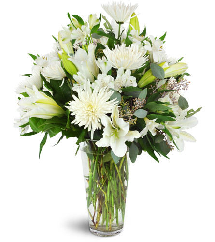 Snowy Elegance™. An arrangement by Avenue Flowers and Gifts. Surprise them with snow-white lilies, mums, alstroemeria, and more arranged in a...