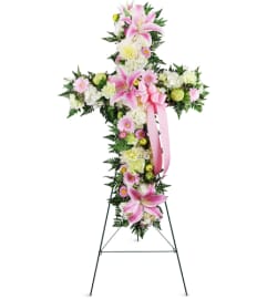 Stargazer Sympathies Cross™. An arrangement by Avenue Flowers and Gifts.