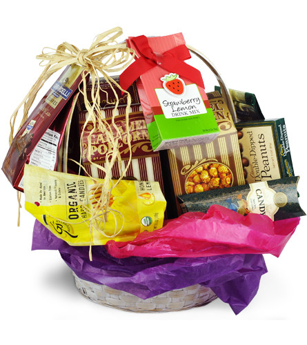 Sweet Treats. An arrangement by Avenue Flowers and Gifts. Approximately one dozen packets of assorted sweet treats are bundled in a basket and...