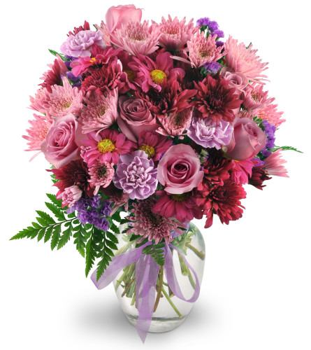 Purple Moon - Deluxe. An arrangement by Avenue Flowers and Gifts. Roses, carnations, chrysanthemums, and statice in shades of pleasing purples are...