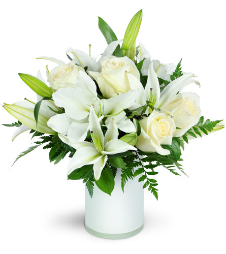 Sweet Notions™. An arrangement by Avenue Flowers and Gifts. Creamy roses and lilies are gracefully arranged in a white vase with assorted greens..
