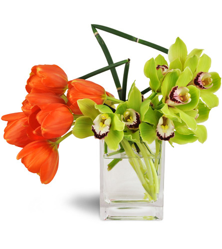 Sunshine Mix Bouquet™. An arrangement by Avenue Flowers and Gifts. Orange tulips and green Cymbidium orchids are artistically arranged in a clear...