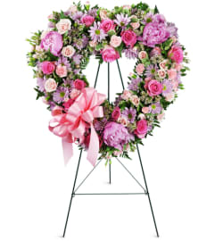With Open Hearts™. An arrangement by Avenue Flowers and Gifts.