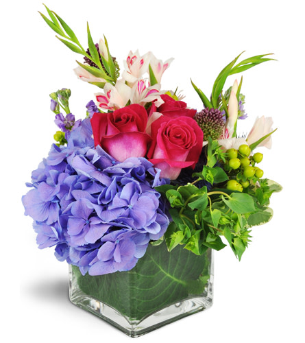 Sweet Delight™. An arrangement by Avenue Flowers and Gifts. Gift them a pretty bouquet of pink roses, purple hydrangea, and pink mini gladiolus..