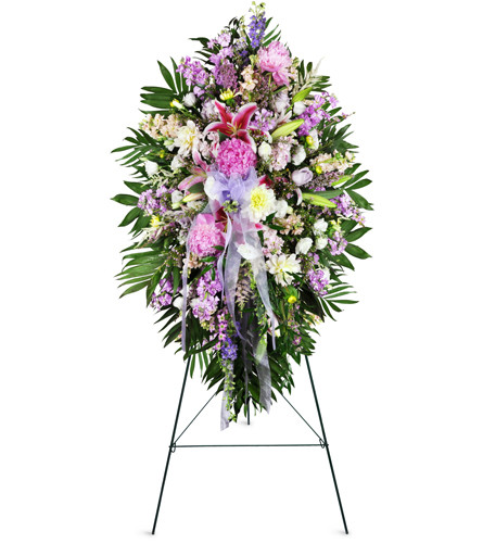 Tender Sentiments Lily Spray™. An arrangement by Avenue Flowers and Gifts. This standing spray features a comforting assortment of lilies,...