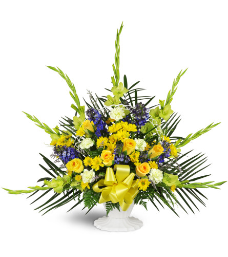 Heaven’s Promise Sympathy Tribute™ - Deluxe. An arrangement by Avenue Flowers and Gifts. Features a classic white basket blooming with blue...