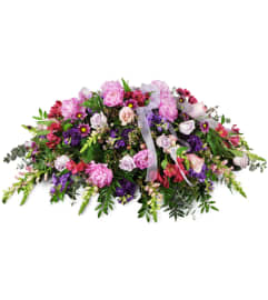 Tender Sentiments Casket Spray™. An arrangement by Avenue Flowers and Gifts.