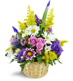 Ode to Springtime Basket™. An arrangement by Avenue Flowers and Gifts.