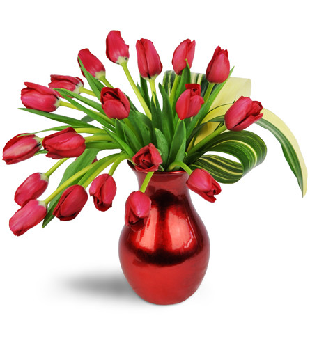 Sophisticated Soul™. An arrangement by Avenue Flowers and Gifts. 20 red tulips are artfully arranged in a red vase..