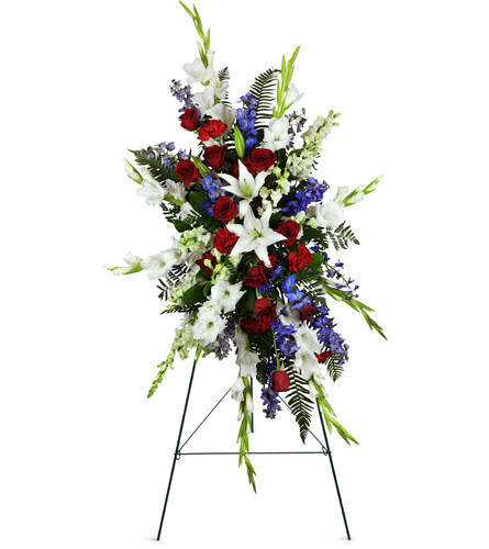 Gentle Repose Lily Spray™. An arrangement by Avenue Flowers and Gifts. Large white lilies, white gladiolus, and classic red roses are tastefully...