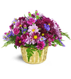 Amethyst Skies Basket™. An arrangement by Avenue Flowers and Gifts.