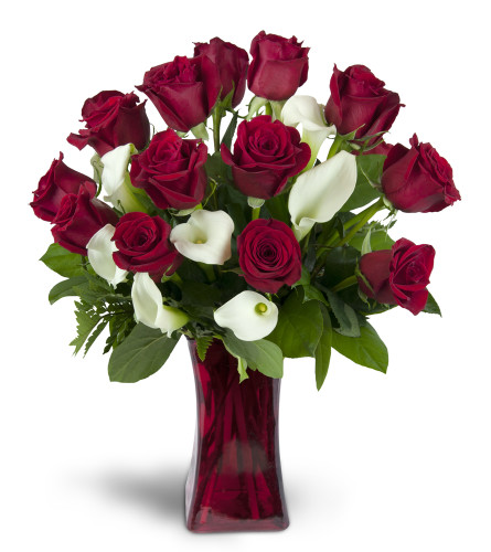 Full of Love™ - Deluxe. An arrangement by Avenue Flowers and Gifts. Classic red roses and mini Calla lilies are elegantly arranged in a glass...