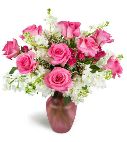 Sweet on You Bouquet™ - Deluxe. An arrangement by Avenue Flowers and Gifts. Hot pink roses are arranged with delicate white stock and charming...