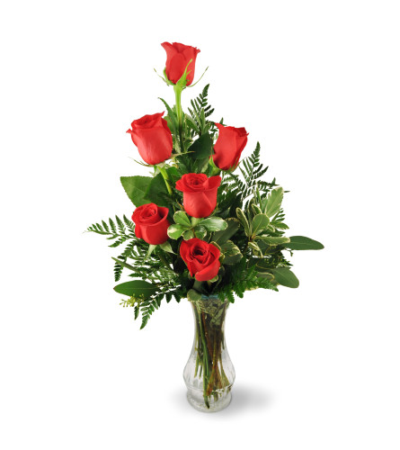 Six Red Roses. An arrangement by Avenue Flowers and Gifts. Melt their heart with six beautiful roses nestled among decorative greens..