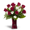 Full of Love™ - Standard. An arrangement by Avenue Flowers and Gifts. Classic red roses and mini Calla lilies are elegantly arranged in a glass...