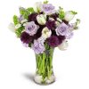 Serene Paradise™ - Deluxe. An arrangement by Avenue Flowers and Gifts. White tulips, Bells of Ireland, and more are beautifully arranged in a...