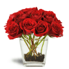 Love's Destiny Bouquet™ - Standard. An arrangement by Avenue Flowers and Gifts. Large red rose blooms burst from a clear glass vase lined with...