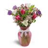 Home Sweet Spring™ - Standard. An arrangement by Avenue Flowers and Gifts. Colorful tulips and waxflower are arranged in a pretty glass vase..