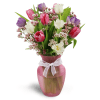 Home Sweet Spring™ - Deluxe. An arrangement by Avenue Flowers and Gifts. Colorful tulips and waxflower are arranged in a pretty glass vase..